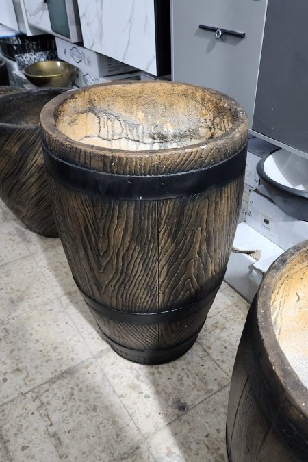 قوّارة بشكل برميل خشبي طويل