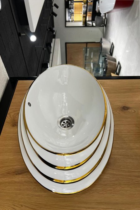 حوض مغسلة بيضاوي أبيض بحافة ذهبية – موديل كلاس جولد